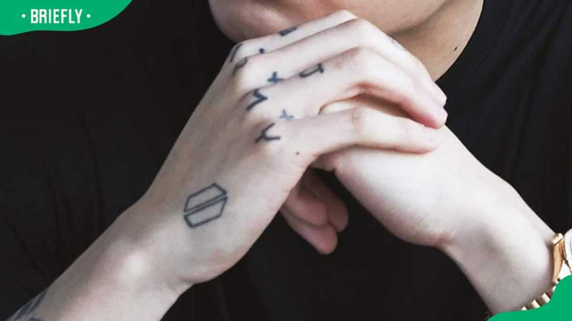 Jungkook's BTS logo tattoo