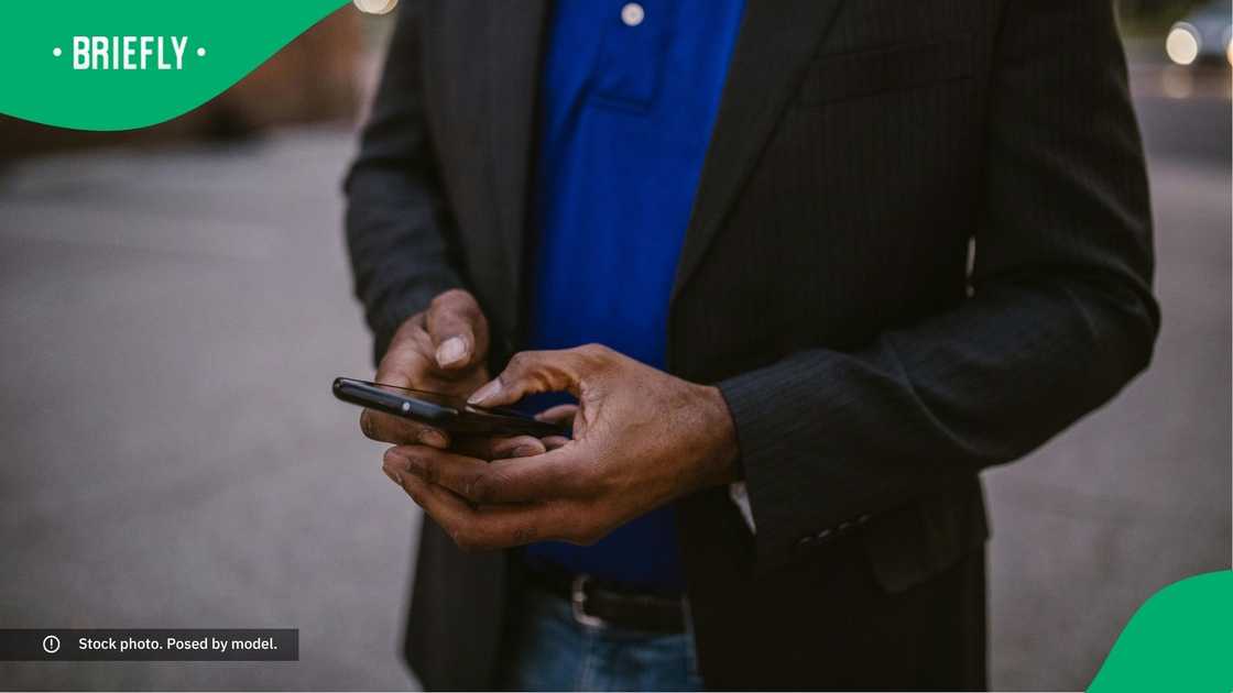 A man typing on his phone.