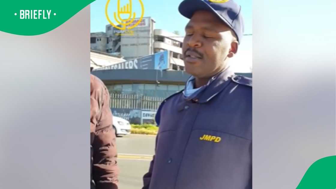 A SAPS police officer. A SAPS police officer.