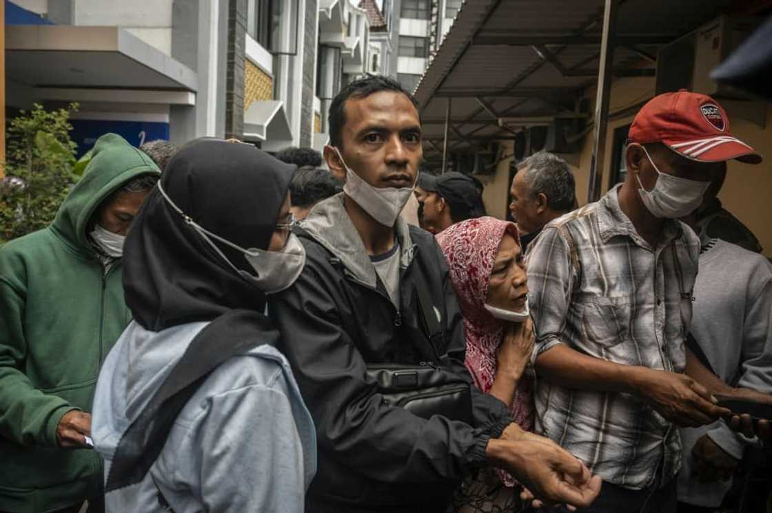 Relatives waited anxiously at hospitals around Malang for news about their loved ones Relatives waited anxiously at hospitals around Malang for news about their loved ones