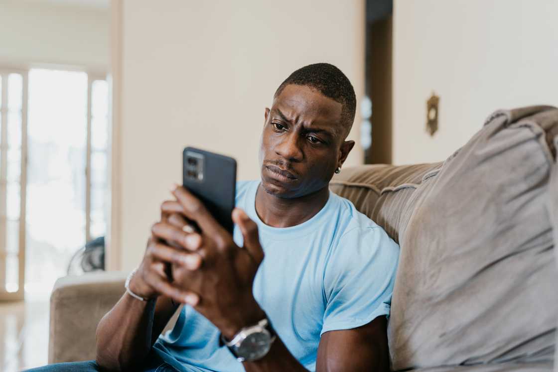 A man texts on his phone