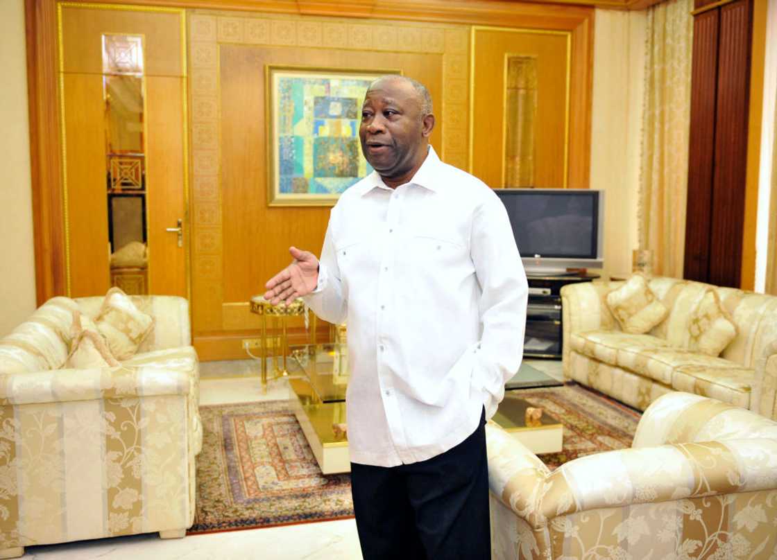 Man standing in a wealthy living room. Man standing in a wealthy living room.