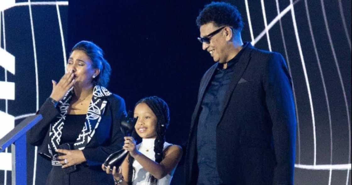 AKA's family accepts his Metro FM Award. AKA's family accepts his Metro FM Award.