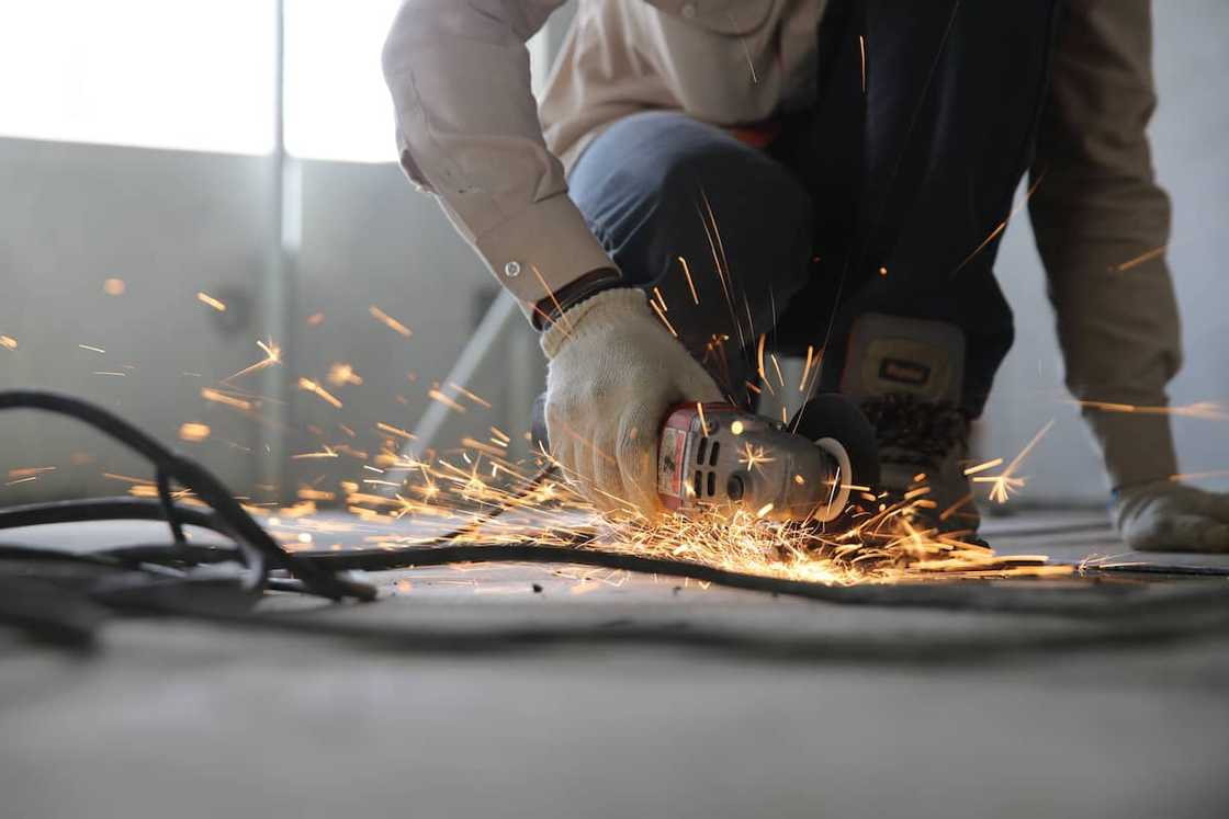 A person holding a grinder