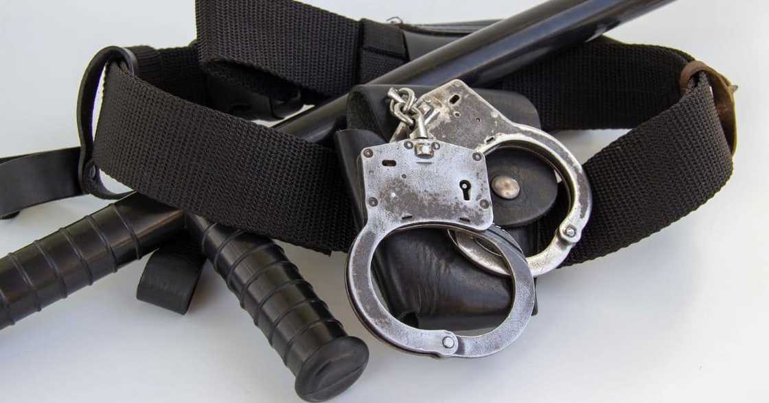 Hand cuffs and police baton Hand cuffs and police baton