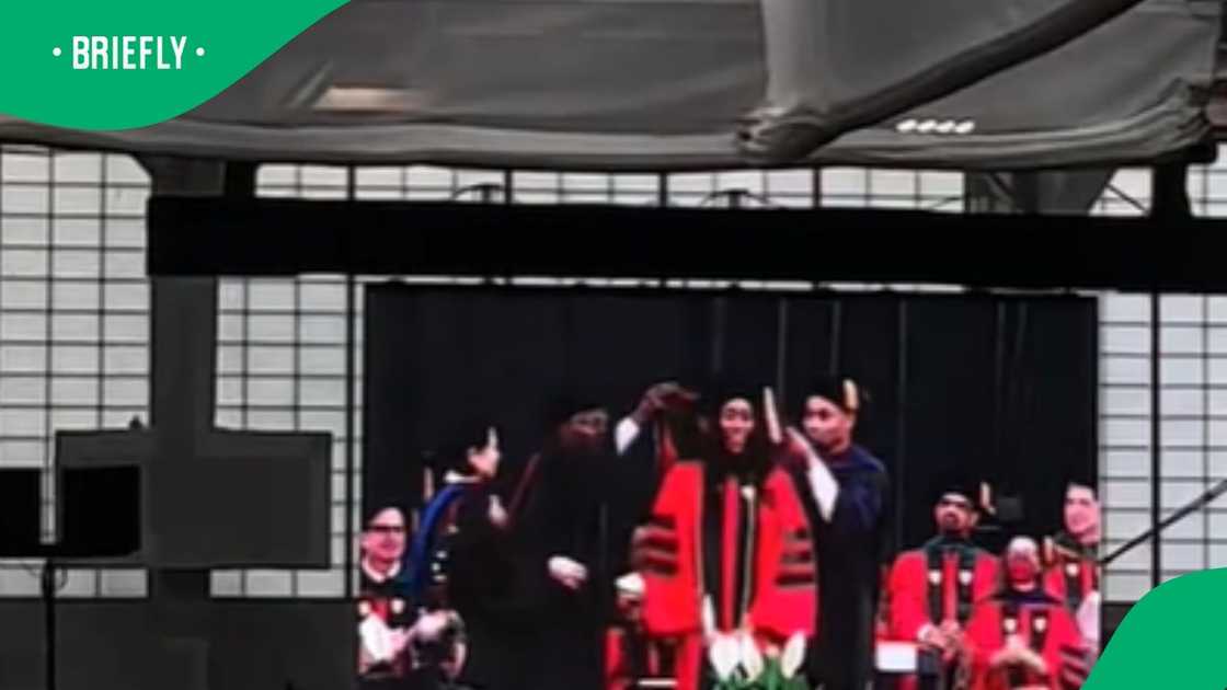 Lady graduates with 2 degrees Lady graduates with 2 degrees