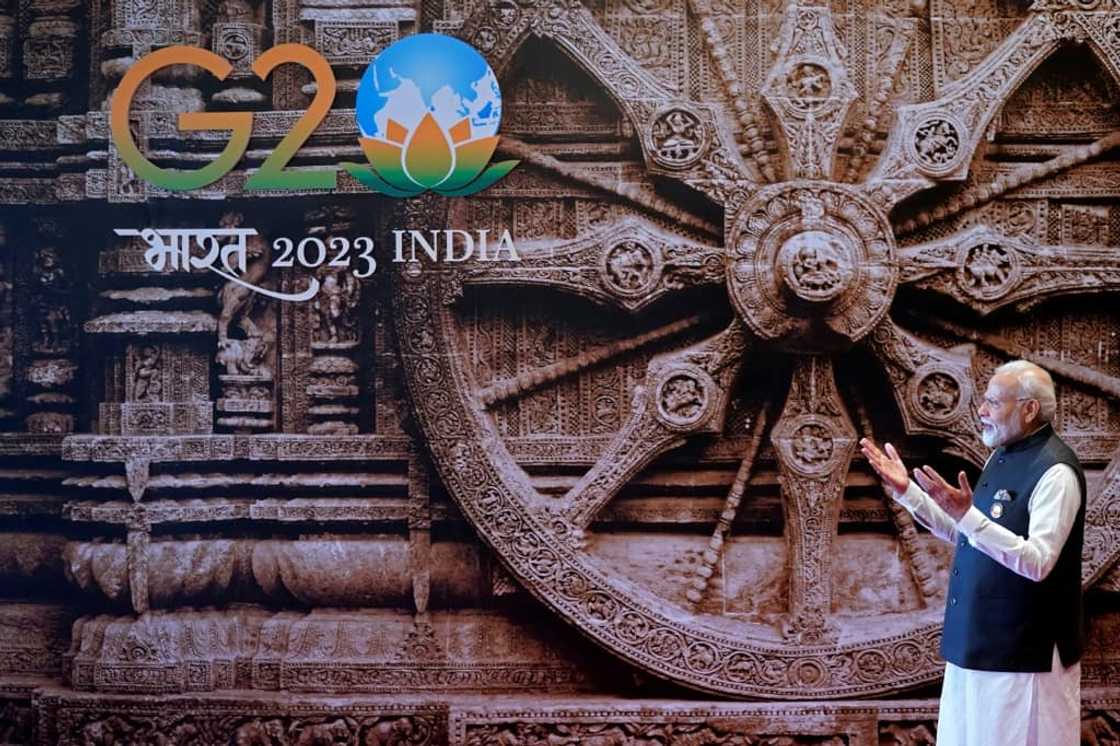 India's Prime Minister Narendra Modi gestures upon the arrival of US President Joe Biden (not pictured) ahead of the G20 Leaders' Summit in New Delhi