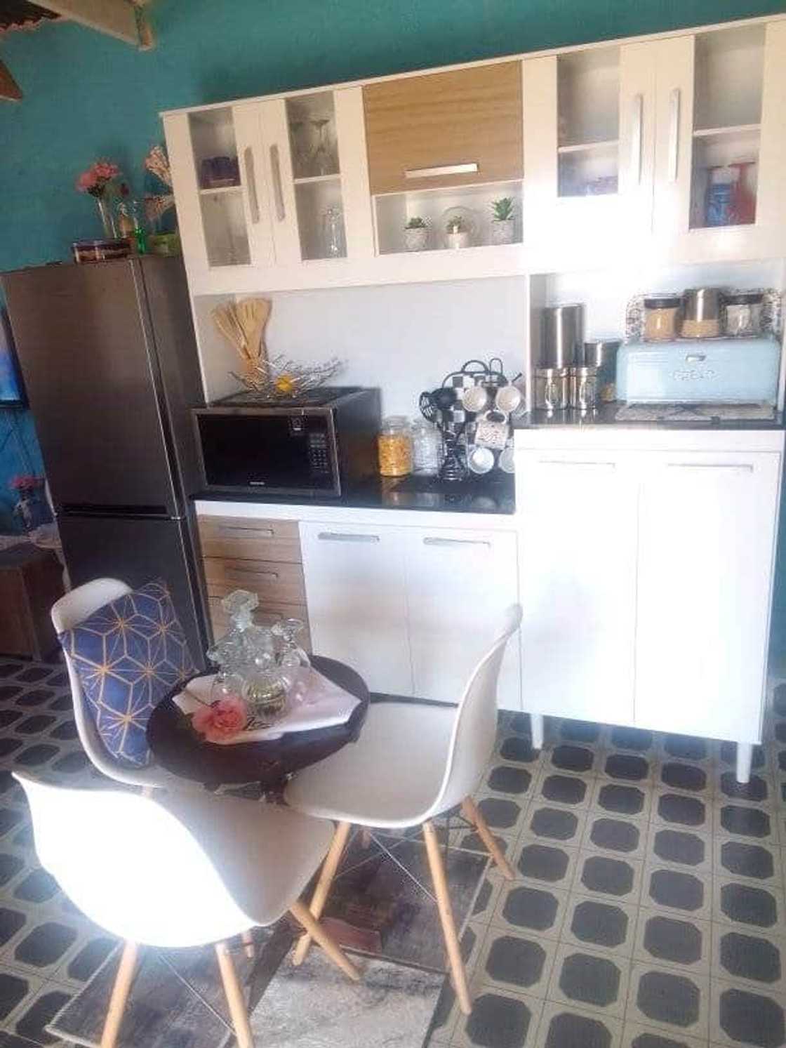 A woman shares photos of her kitchen. A woman shares photos of her kitchen.