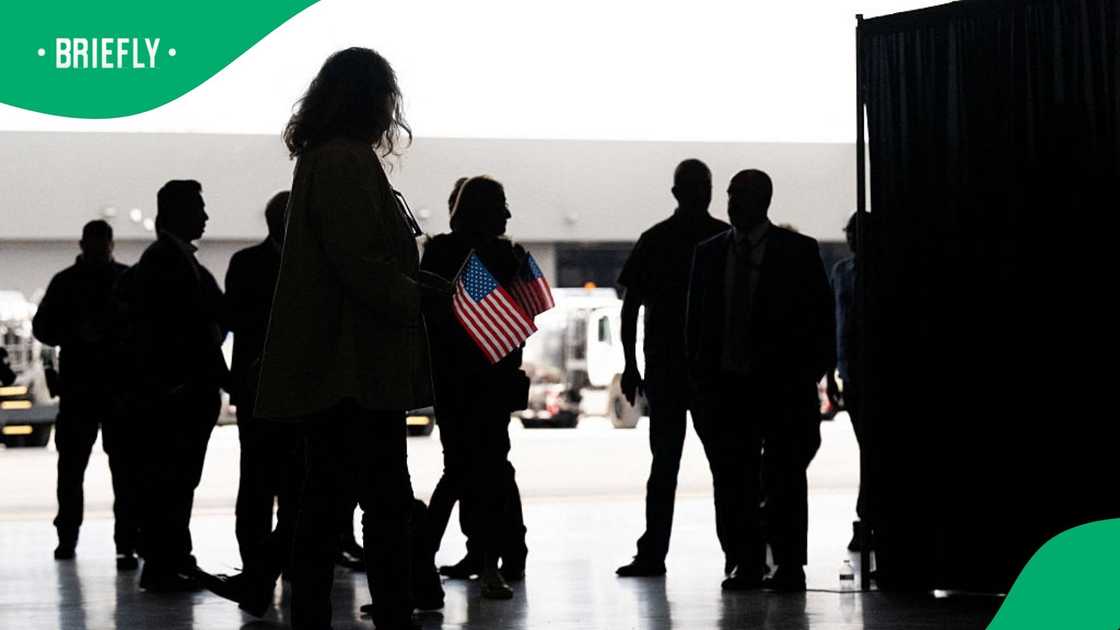 The first group of Afrikaners from South Africa to arrive for resettlement listen to remarks from US Deputy Secretary of State Christopher Landau and US Deputy Secretary of Homeland Security Troy Edgar