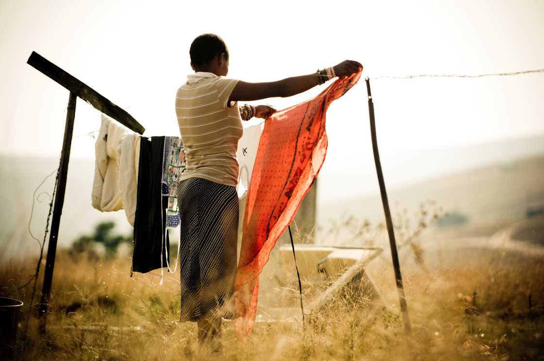 A woman hanging laundry