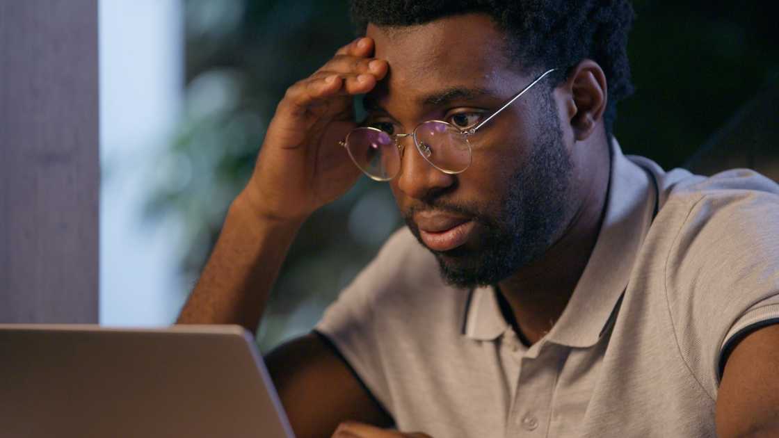 A man looking at a laptop A man looking at a laptop