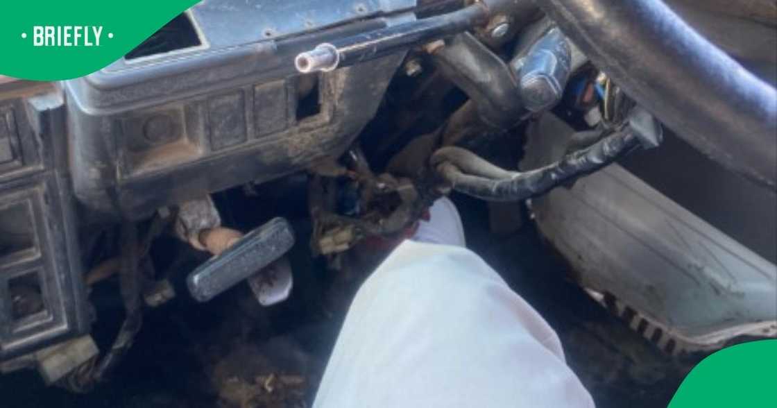 A taxi passenger held the brakes while the driver stepped outside. A taxi passenger held the brakes while the driver stepped outside.