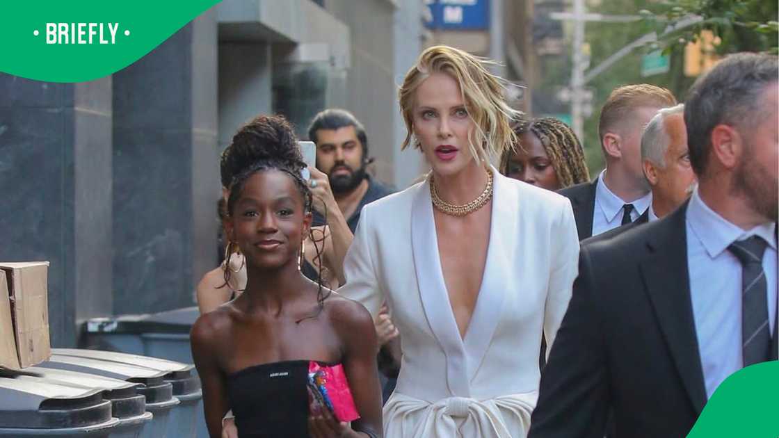 Charlize Theron is facing criticism after viral family photos resurfaced.