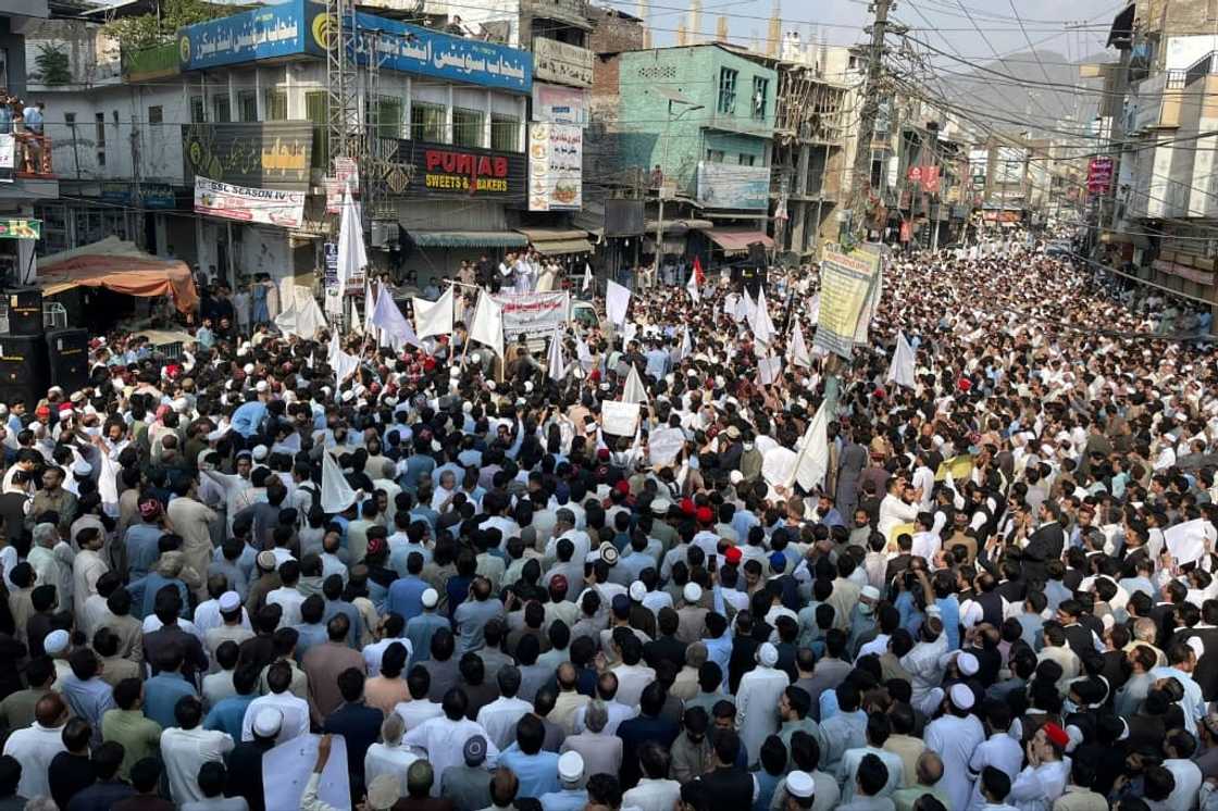 People take part in a protest a day after an attack on a school bus in Mingora, in the Swat District of Khyber Pakhtunkhwa in October. People take part in a protest a day after an attack on a school bus in Mingora, in the Swat District of Khyber Pakhtunkhwa in October.