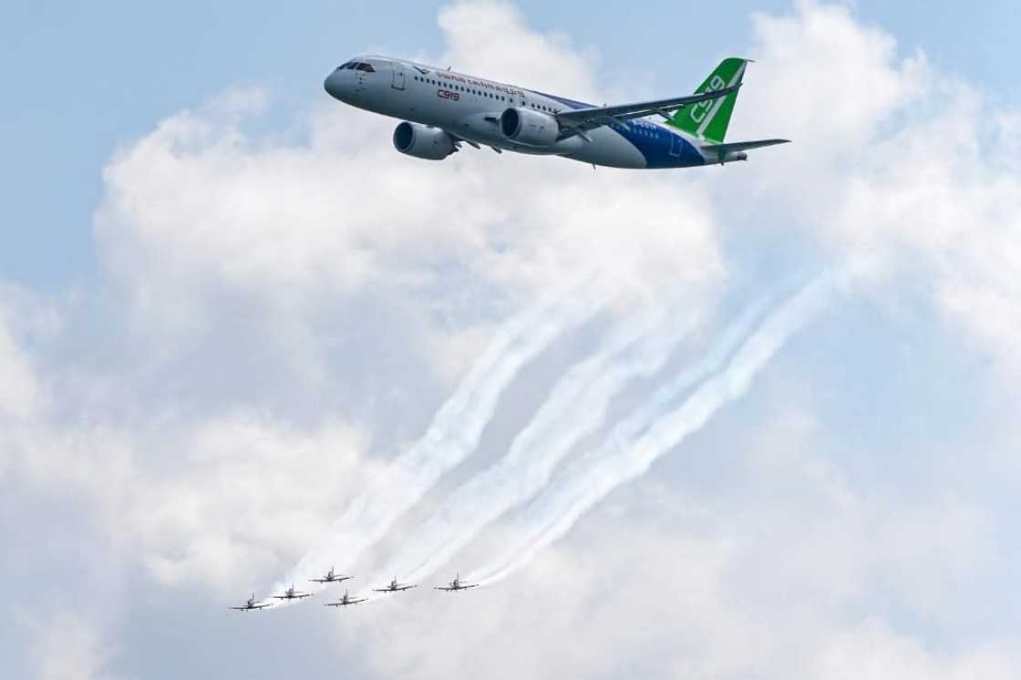 The C919 (top, with the RAAF Roulettes aerobatic team performing in Pilatus PC-21s) will take part in daily flying dispalys at the airshow The C919 (top, with the RAAF Roulettes aerobatic team performing in Pilatus PC-21s) will take part in daily flying dispalys at the airshow