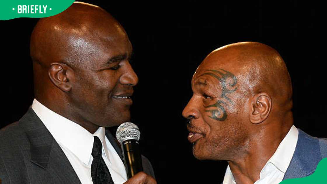 Evander Holyfield (L) and Mike Tyson at the New Tropicana Las Vegas Evander Holyfield (L) and Mike Tyson at the New Tropicana Las Vegas