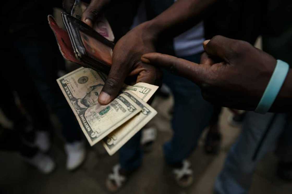 Give us greenbacks: For many Zimbabweans, the US dollar is the currency of choice Give us greenbacks: For many Zimbabweans, the US dollar is the currency of choice