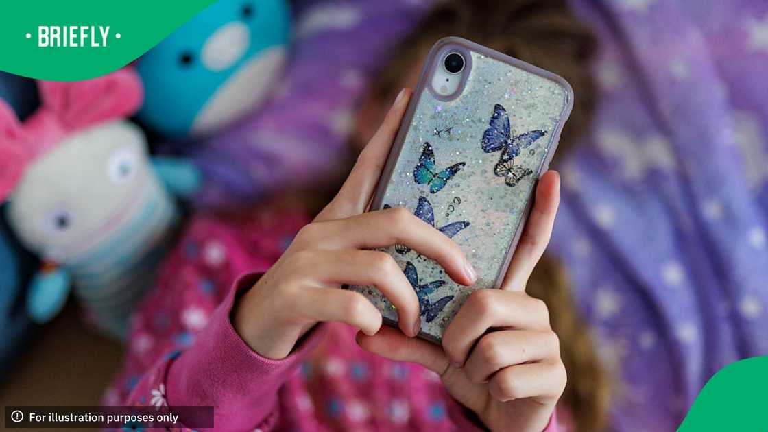 A girl lies in her bed using her smartphone on July 22, 2025 in Berlin, Germany A girl lies in her bed using her smartphone on July 22, 2025 in Berlin, Germany
