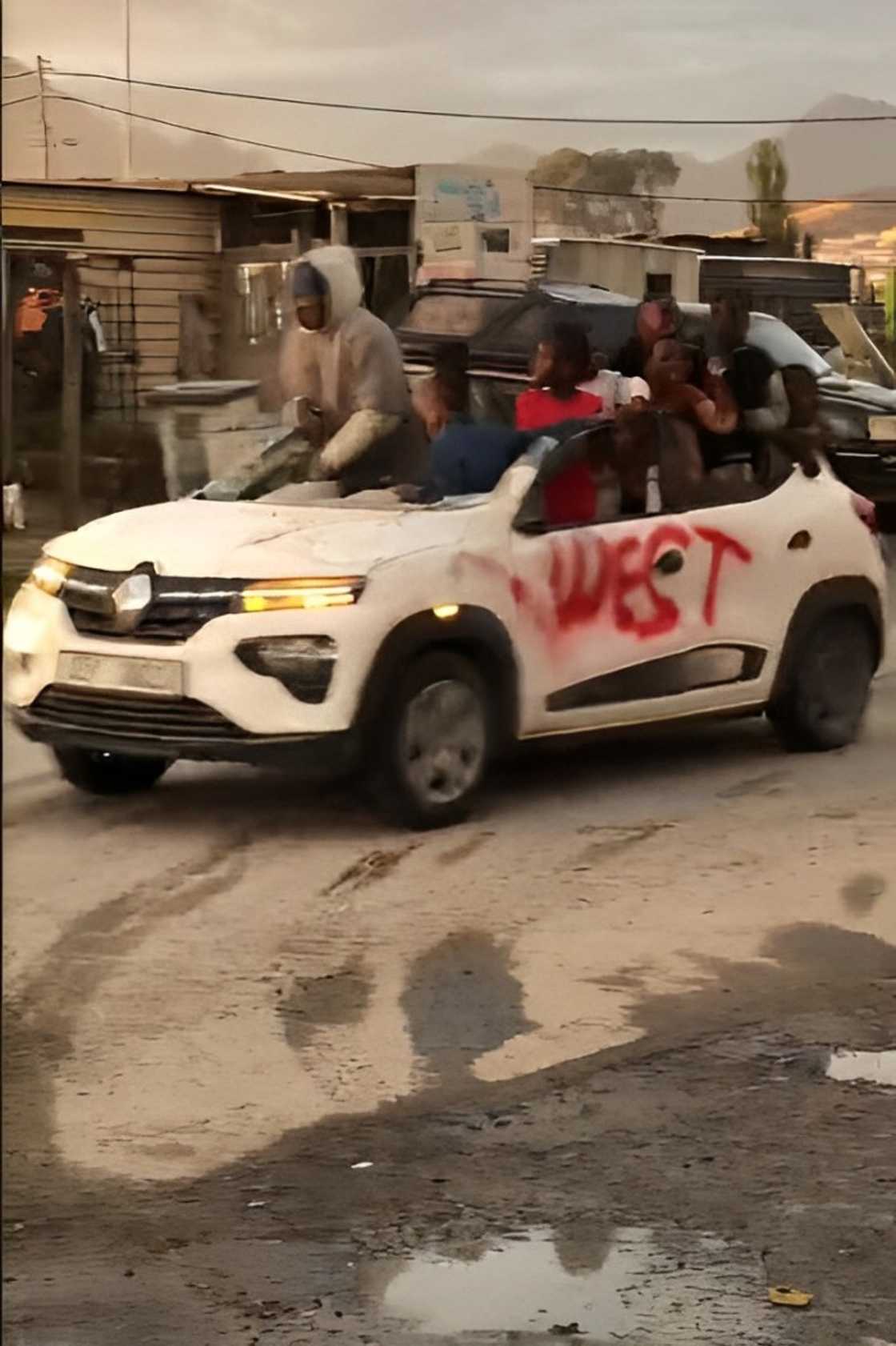 A customised Renault Kwid without a roof drove in the kasi. A customised Renault Kwid without a roof drove in the kasi.