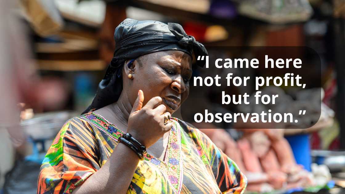 A lady in the market addresses the traders A lady in the market addresses the traders
