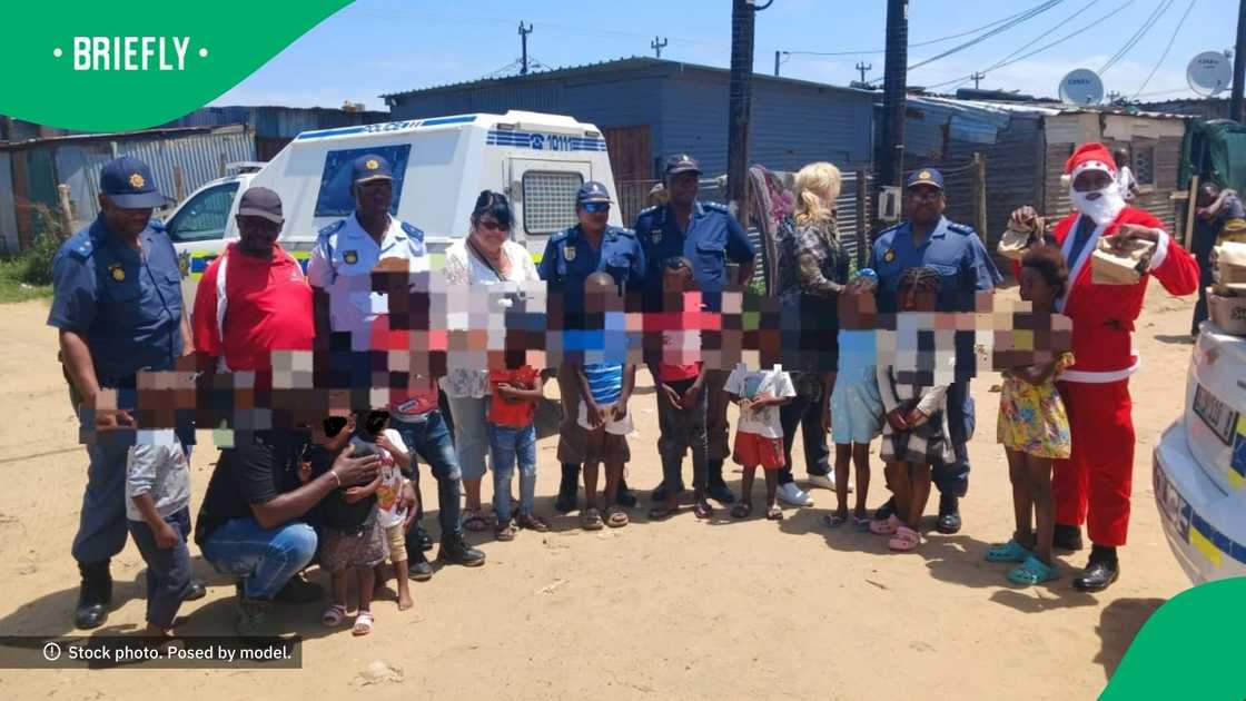 East London SAPS members visited a community dressed as Santa