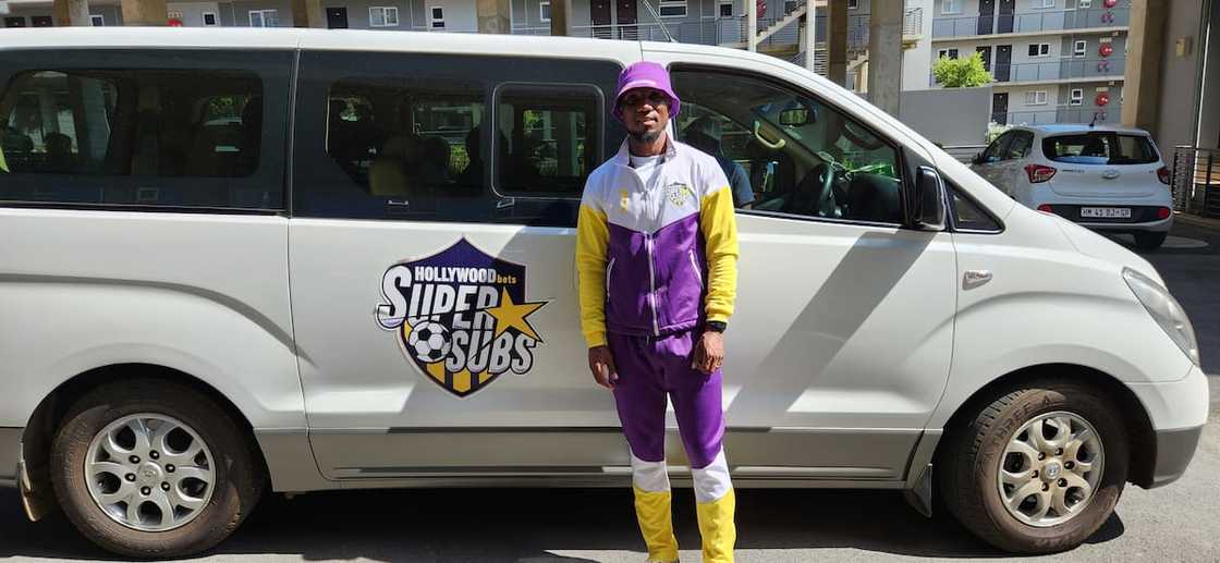 Teko Modise in front of Hollywoodbets van