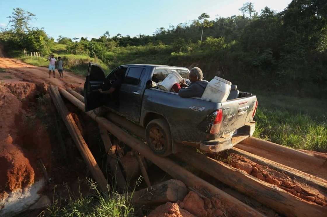 Alleged illegal miners leave an illegal mining area inside Yanomami indigenous lands Alleged illegal miners leave an illegal mining area inside Yanomami indigenous lands