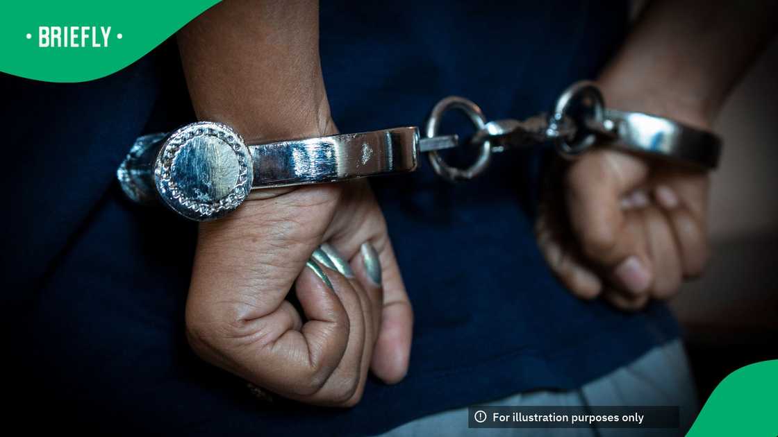 A woman handcuffed A woman handcuffed