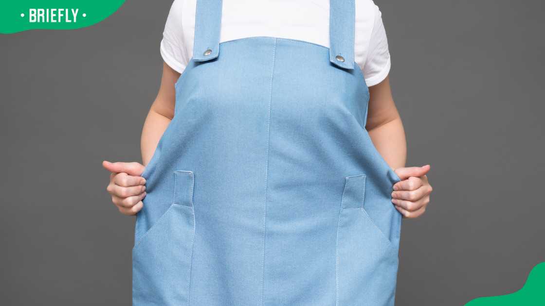 A woman in an oversized dress A woman in an oversized dress