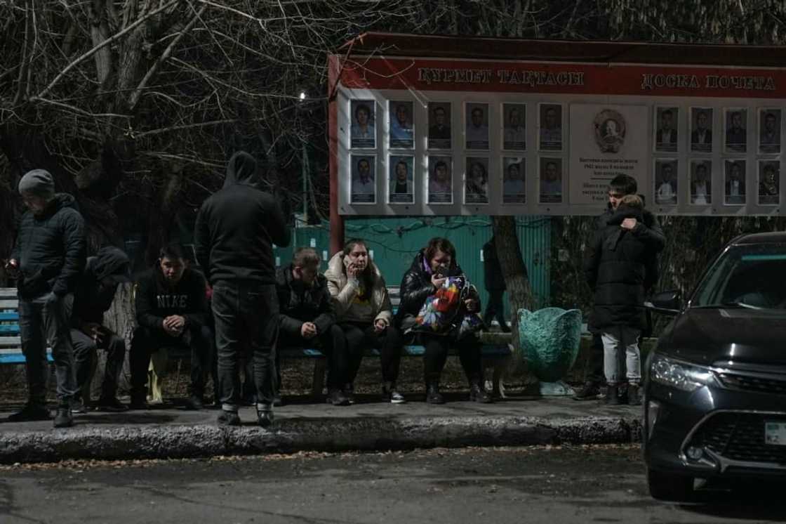 Relatives of miners gather outside the Kostenko ArcelorMittal coal mine building