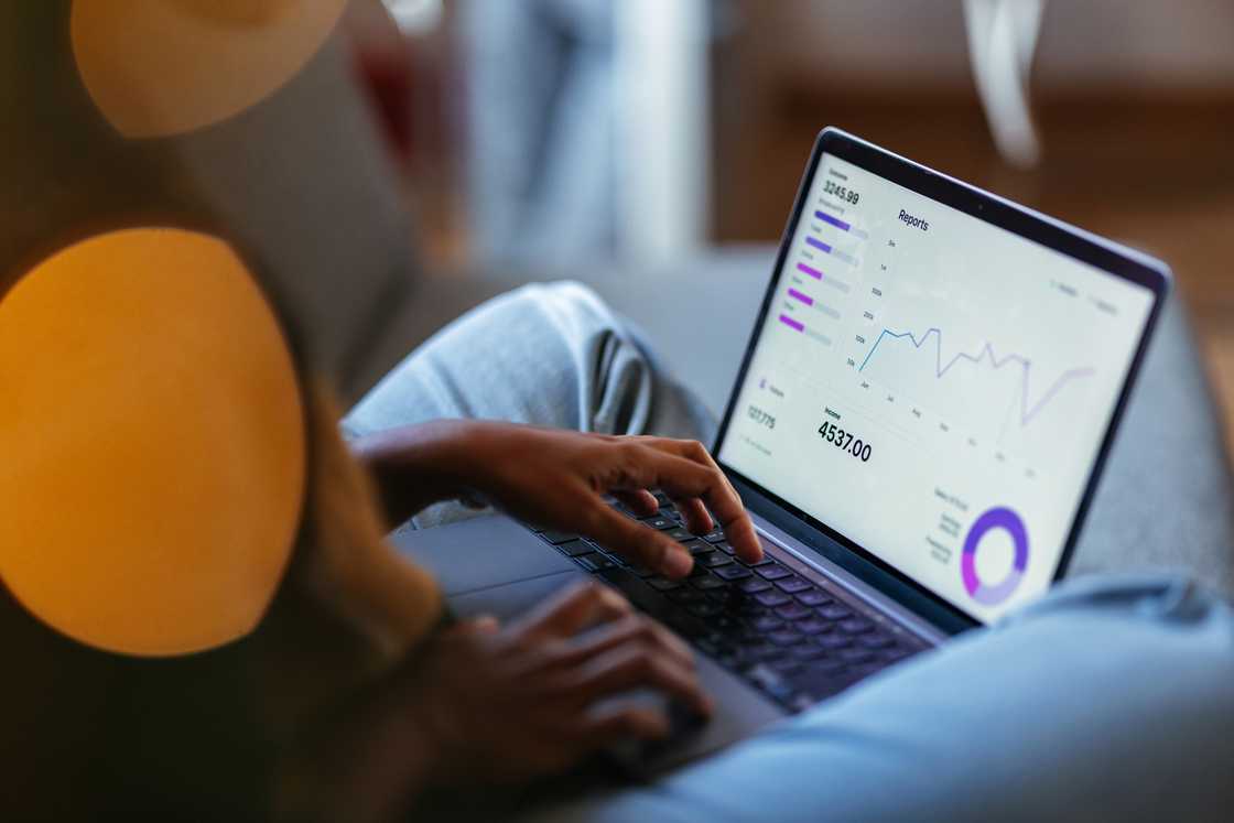 Data analyst checking business analytics dashboard with charts, metrics and KPI on digital tablet. Data analyst checking business analytics dashboard with charts, metrics and KPI on digital tablet.