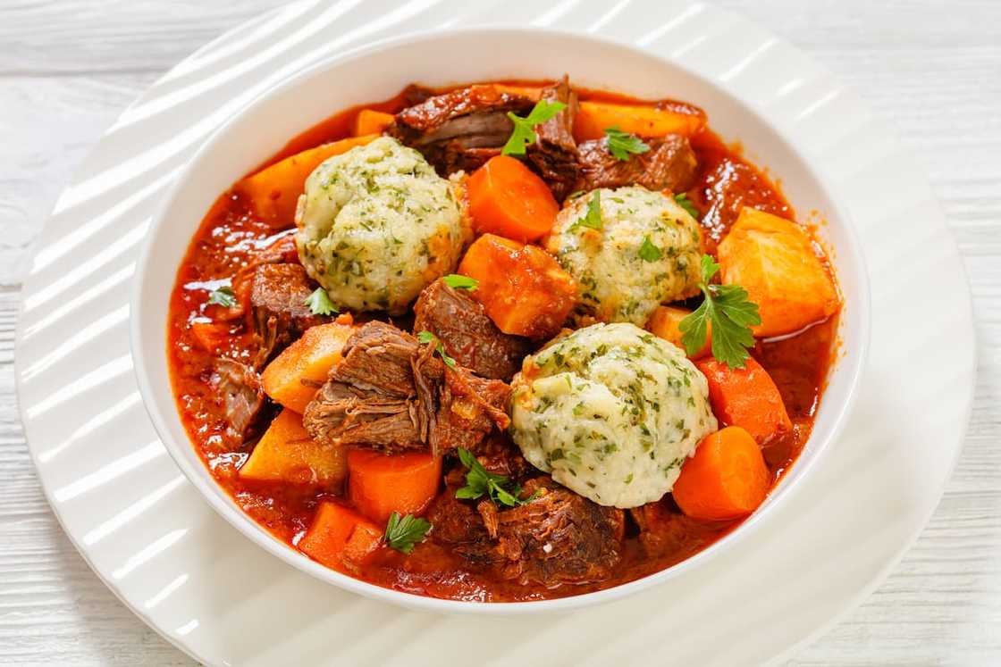 Tomato-rich beef stew and dumplings