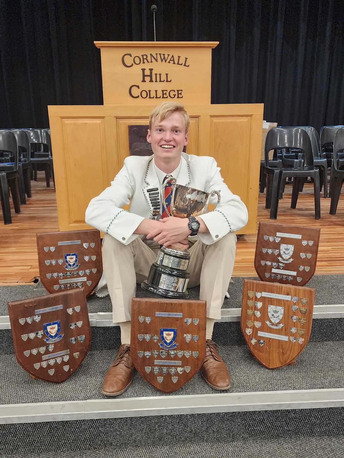 Joshua Andrews with his awards.