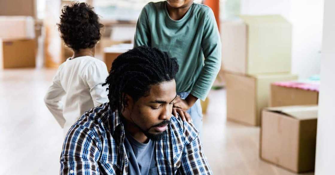 A father going through divorce worries about his children A father going through divorce worries about his children