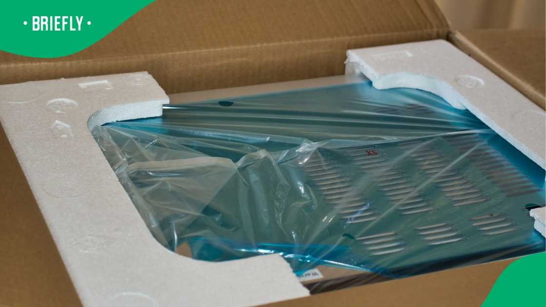 A stock photo of an item being unboxed A stock photo of an item being unboxed