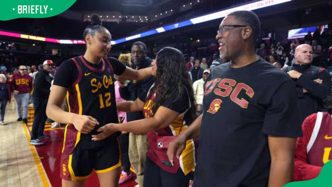 JuJu Watkins (12) is congratulated by mother Sari Neal-Wakins and father Robert Neal-Watkins
