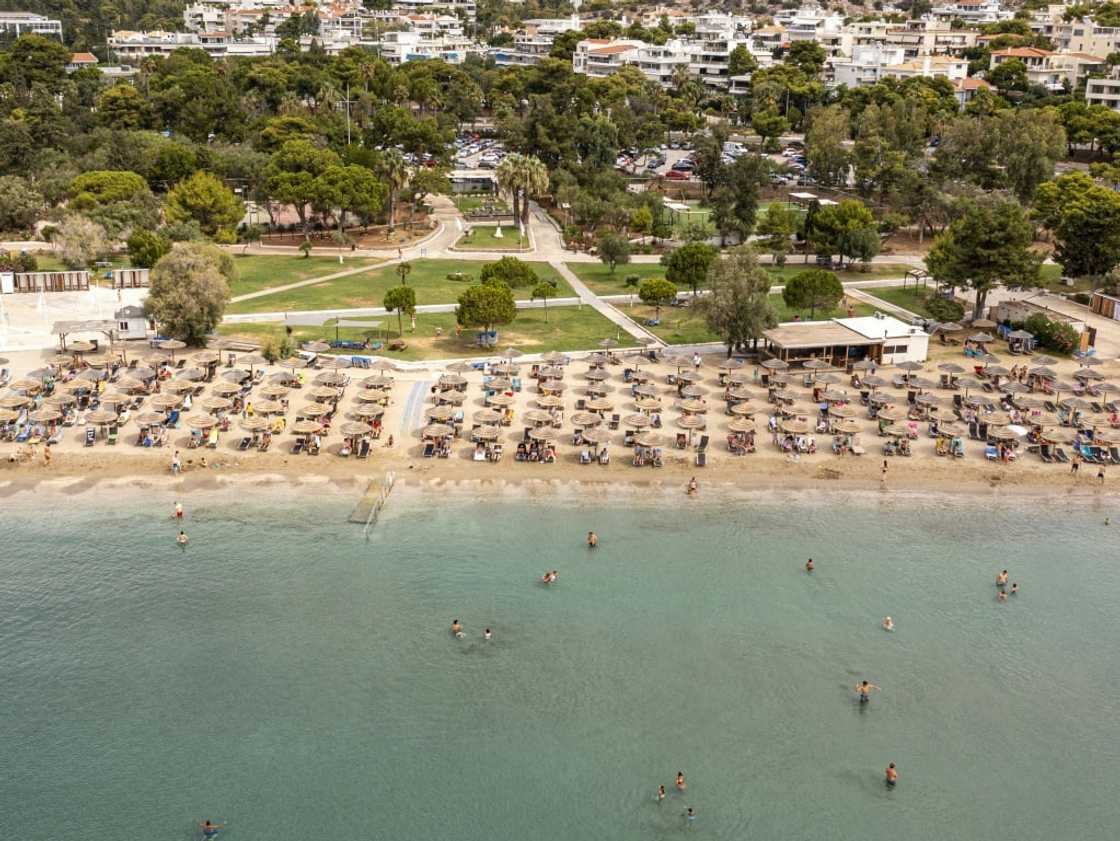 Greek law says 50 percent of every beach must be clear so people can get to the sea Greek law says 50 percent of every beach must be clear so people can get to the sea