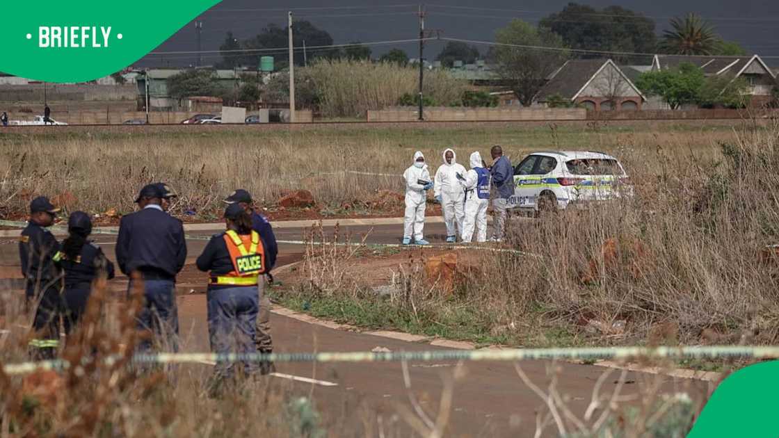 Members of the South African Police Service (SAPS) Forensic Pathology Services work on the crime scene where the body of a woman was discovered in Boksburg on September 17, 2026 Members of the South African Police Service (SAPS) Forensic Pathology Services work on the crime scene where the body of a woman was discovered in Boksburg on September 17, 2026