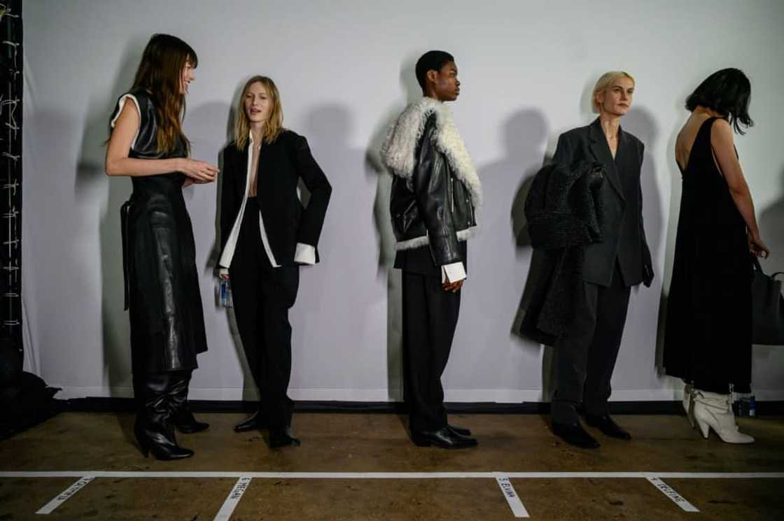Models wearing clothing by Proenza Schouler gather backstage prior to their runway show during New York Fashion Week Models wearing clothing by Proenza Schouler gather backstage prior to their runway show during New York Fashion Week