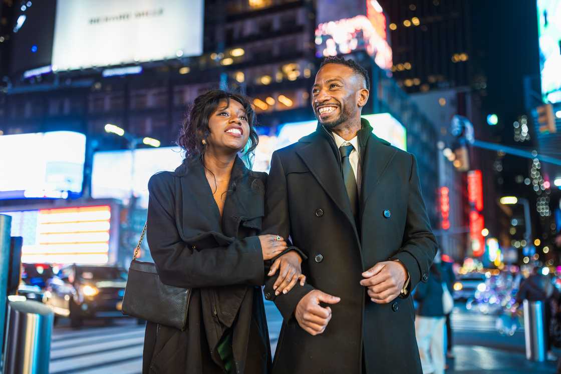 A couple walking together outdoors A couple walking together outdoors