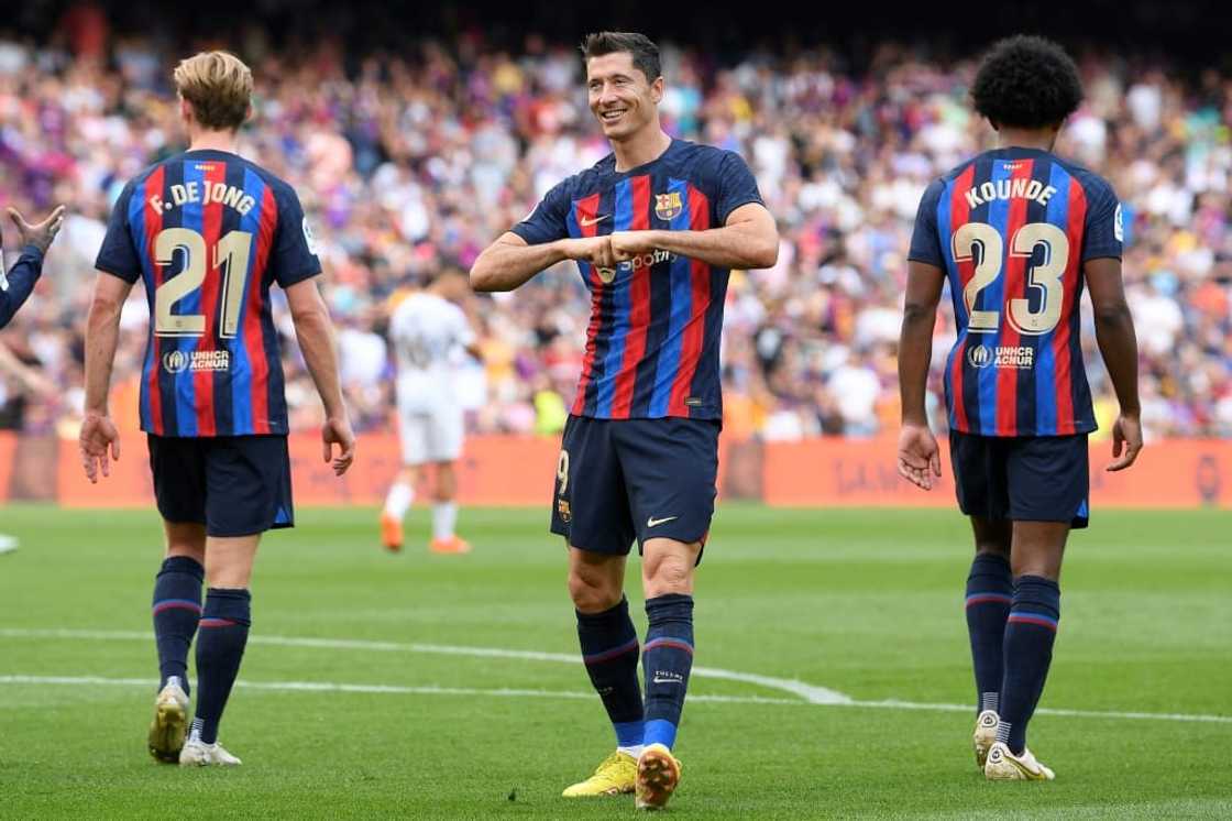 Robert Lewandowski (C) and Jules Kounde (R) were among Barcelona's big-name summer signings while the club failed to persuade Frenkie de Jong (L) to leave