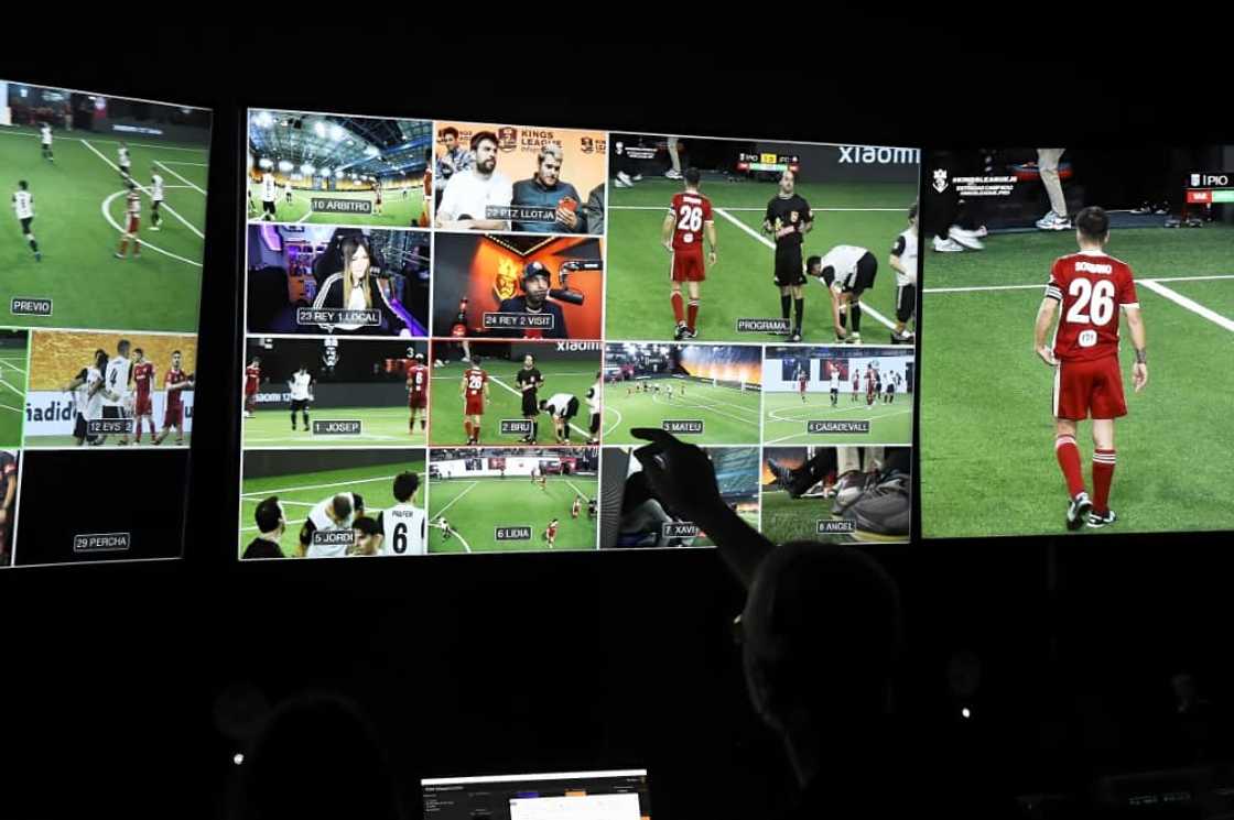 A live-stream producer points a screen in the production control room on a Kings League match day A live-stream producer points a screen in the production control room on a Kings League match day