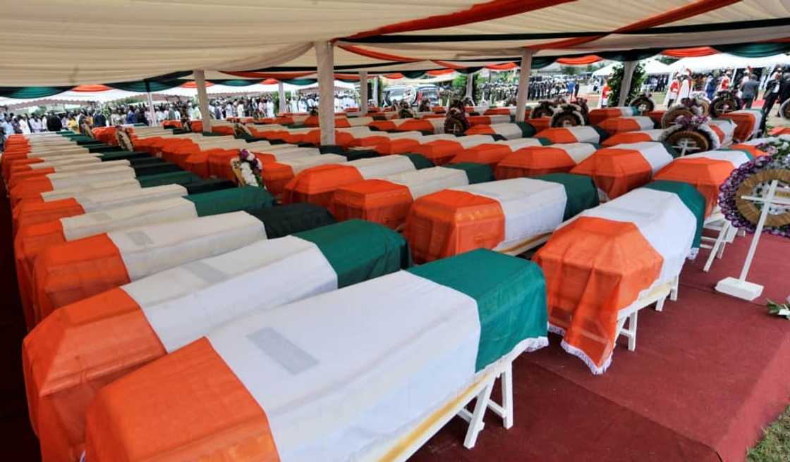 Conflict: A mass burial of 100 victims of the fighting, in October 2011 Conflict: A mass burial of 100 victims of the fighting, in October 2011