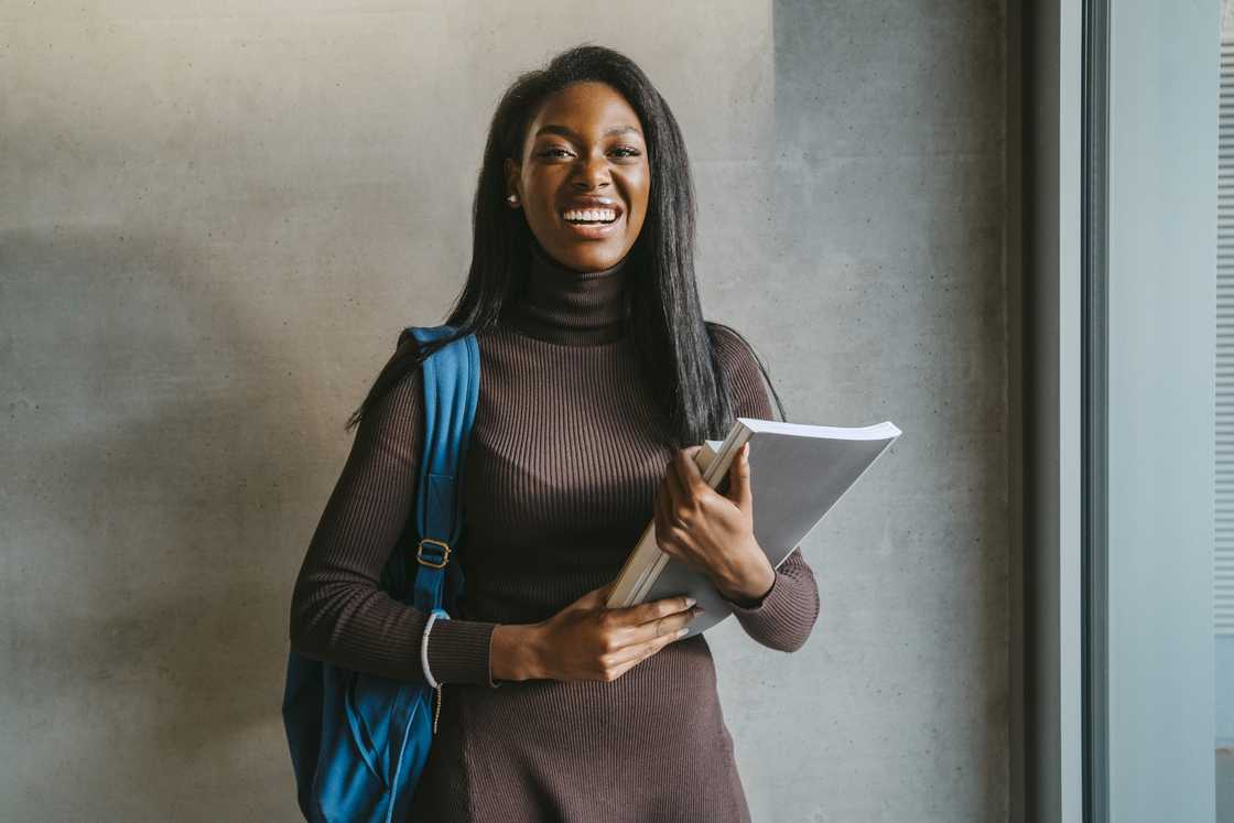 A university student holding books