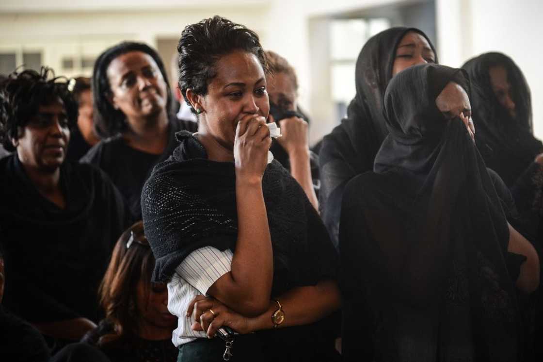 Woman mourns death of a loved one Woman mourns death of a loved one