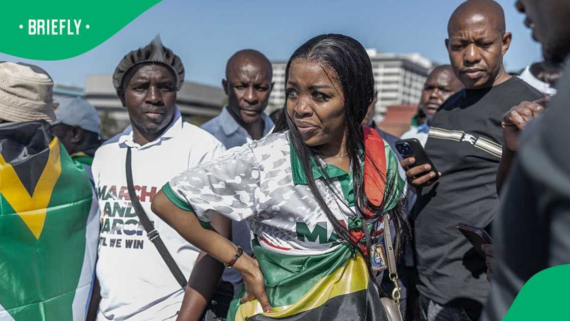 March and March Movement leader Jacinta Ngobese-Zuma gestures during a protest under the theme "It's Time to Fetch Your People" outside the Durban International Convention Centre (ICC) March and March Movement leader Jacinta Ngobese-Zuma gestures during a protest under the theme "It's Time to Fetch Your People" outside the Durban International Convention Centre (ICC)