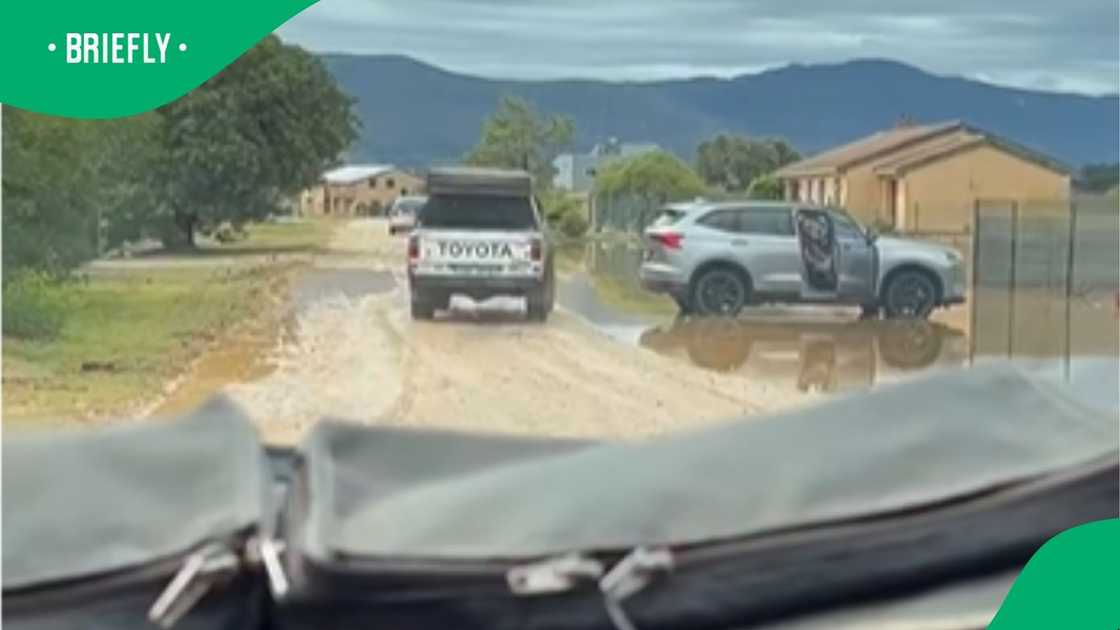 Man in Toyota bakkie tries luck with flooded road Man in Toyota bakkie tries luck with flooded road