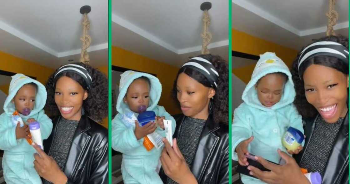 Mom hands toddler items to hold for her. Mom hands toddler items to hold for her.