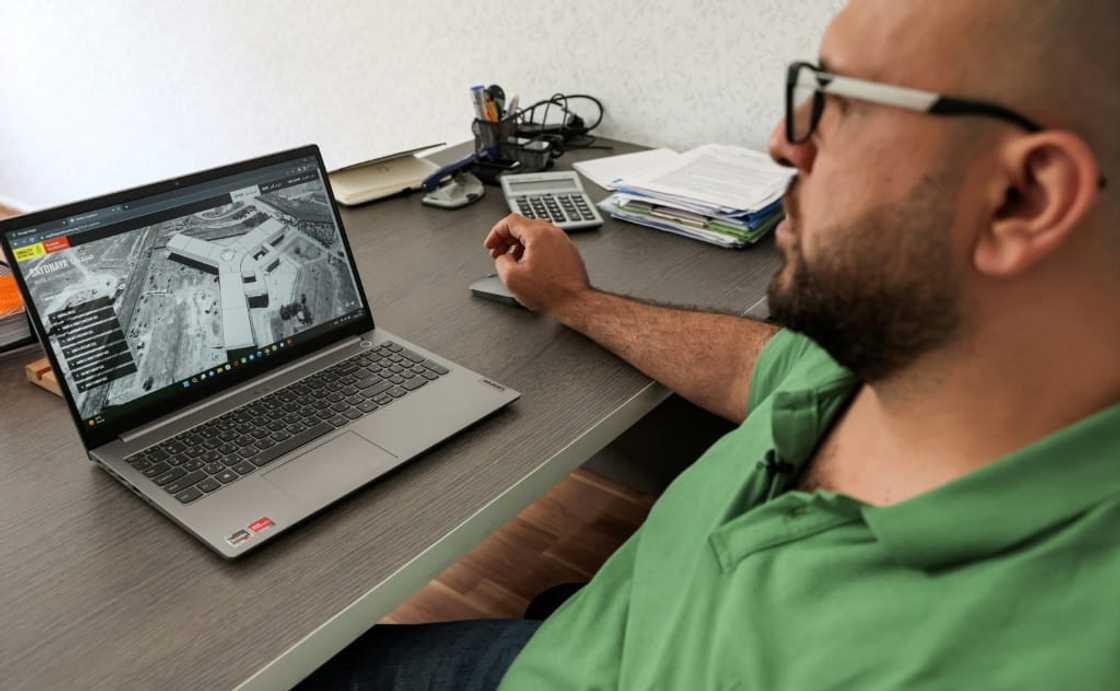 Diab Serriya, of the Association of Detainees and the Missing in Sednaya Prison, views a computer screen showing an image of the prison Diab Serriya, of the Association of Detainees and the Missing in Sednaya Prison, views a computer screen showing an image of the prison
