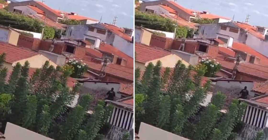 Man on a rooftop dodges bullets fired by police officers Man on a rooftop dodges bullets fired by police officers